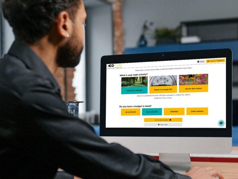 Homeowner on a computer exploring their Ecofurb Options for free online retrofit advice