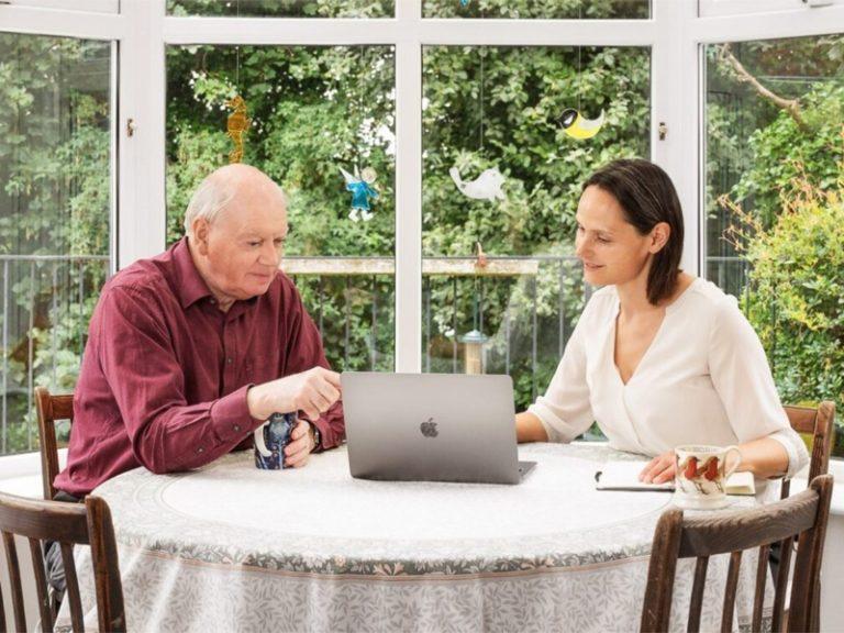 Vaughan and his Retrofit Coordinator discussing plans at the table