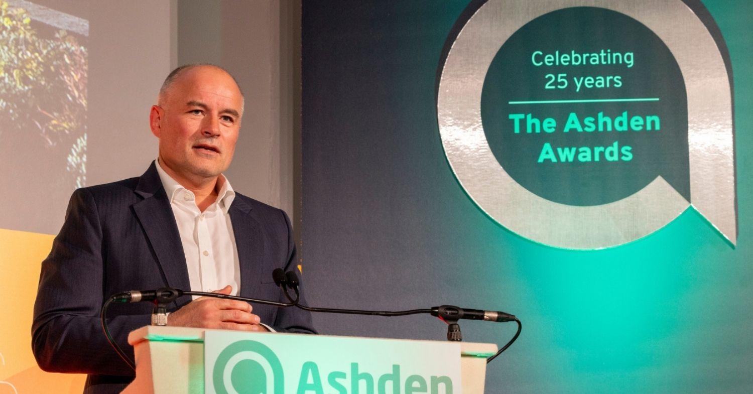 Russell Smith accepting the 2025 Ashden Award for Outstanding Achievement on behalf of Cotality